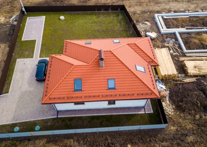 house-metal-shingle-roof-with-attic-windows-black-car house-metal-shingle-roof-with-attic-windows-black-car
